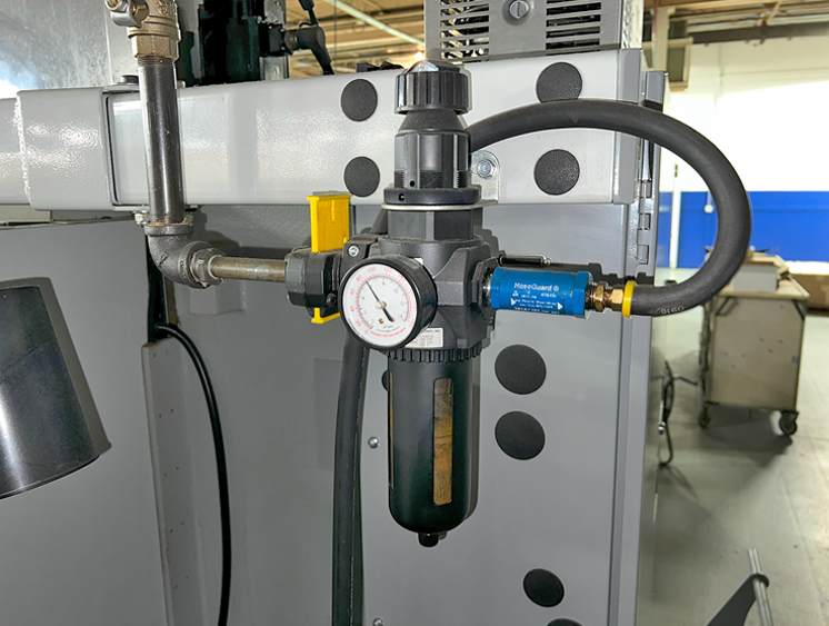 A HoseGuard on a CNC machine, protecting workers and equipment